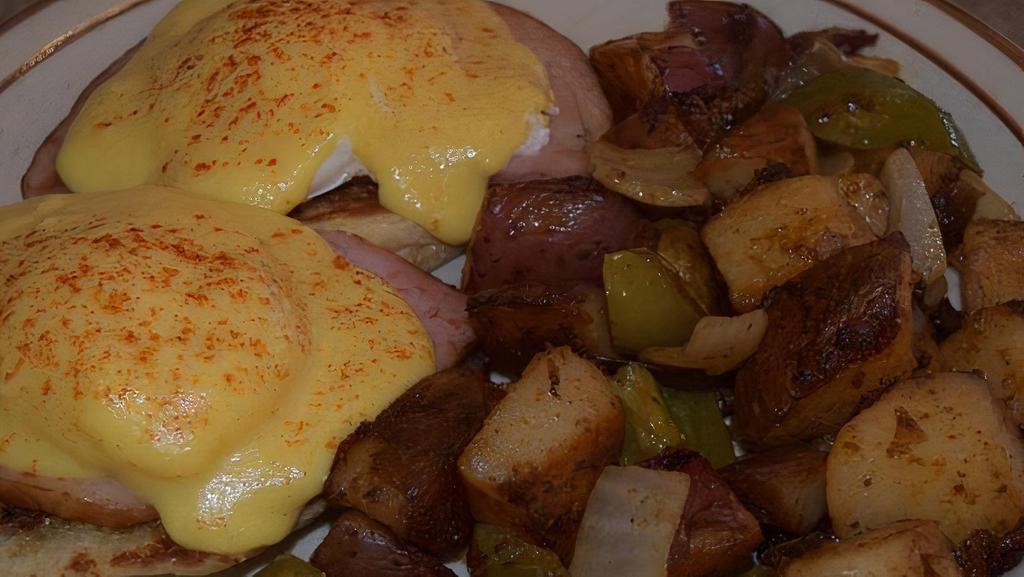 Eggs Benedict · Ham with 2 poached eggs on a toasted english muffin with hollandaise sauce and hash browns