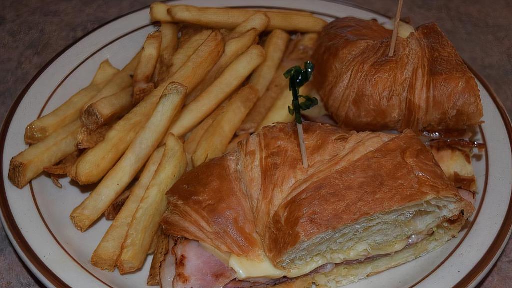 Ham And Swiss Cheese Croissant · Cold sliced ham, swiss cheese, onions, tomato, mayonnaise and mustard.