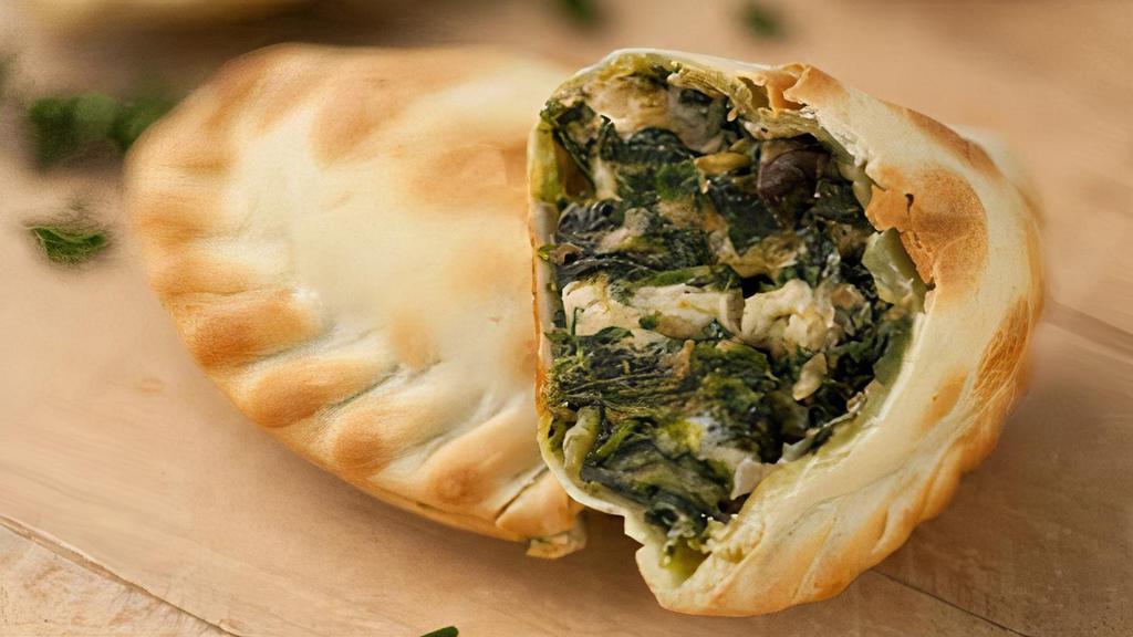 House made Spinach Feta Empanada · Organic spinach, onions, Feta cheese and a blend of jack and cheddar cheese