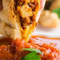 Vegan Spicy Italian Sausage Empanada · Tofu-based Italian sausage, onions, red and green bell peppers.