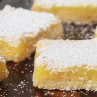 Lemon Bar · A beloved classic treat! Buttery shortbread crust, tangy lemon filling, and a dusting of pow...