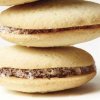 Traditional Alfajor · Handcrafted shortbread cookies joined with dulce de leche and rolled in grated coconut - Arg...