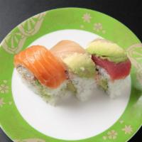 Rainbow Roll (9pcs) · Imitation crab avocado roll topped with assorted fish.