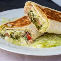 Falafel Wrap · Falafel, hummus, tahini salad, tahini and lettuce wrapped in lavash, a salad with organic sp...
