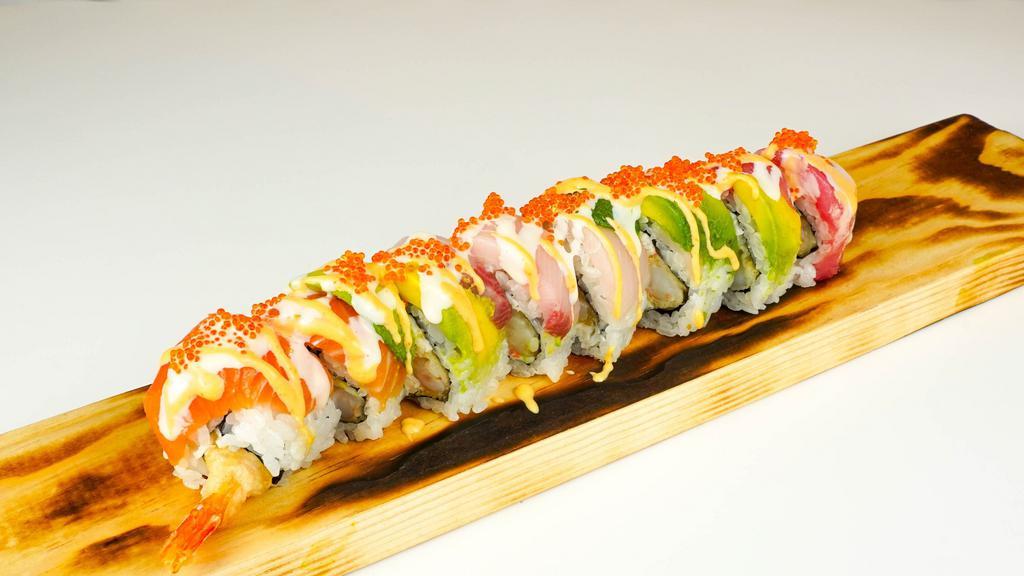 Rainbow Dragon Roll · Tempura shrimp, crab meat, avocado, topped with salmon, tuna, hamachi, tobiko and sauce.