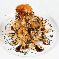 Volcano Roll · Deep fried spicy tuna with cream cheese, topped with sesame & tobiko.