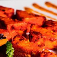 Cajun Paneer Tikka · Fresh cheese, marinated in yogurt, spices, fennel seeds & chilies; skewered and cooked in cl...