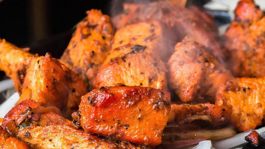 Peshawari Chicken · Cubes of boneless organic chicken thigh marinated with yogurt, ginger, garlic and spices, cooked in tandoor.