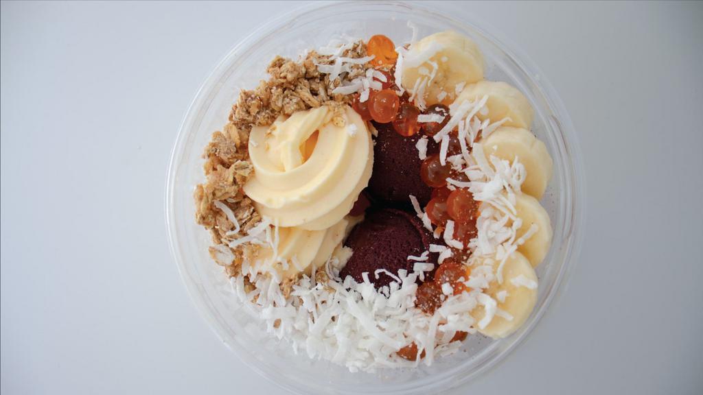 Tropicalicious Bowl · Life’s sweeter with this Tropicalicious Bowl. It’s made with organic Acai, dairy-free Pineapple Sorbet, Granola, Bananas, and Coconut Shreds.