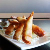 Fried Shrimps · Tail-on shrimp wrapped in a wonton and deep fried until crispy golden brown accompanied with...