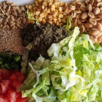 Tea Leaf Salad · Marinated fermented tea leaves, romaine lettuce, tomatoes, jalapenos, fried garlic, sesame s...