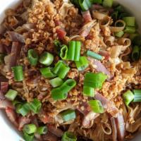 Garlic Noodles · Fresh egg noodles,  garlic, garlic oil, soy sauce, green onions and topped with BBQ Pork Inc...
