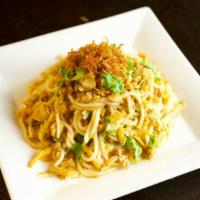Nan Gyi Dok · Round rice noodles, diced chicken in a mild coconut curry sauce, egg, roasted bean powder, c...