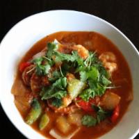 Shrimp Curry · Onion garlic tomato based curry, shrimp, yellow onions, bell
peppers, mild chili sauce, cila...