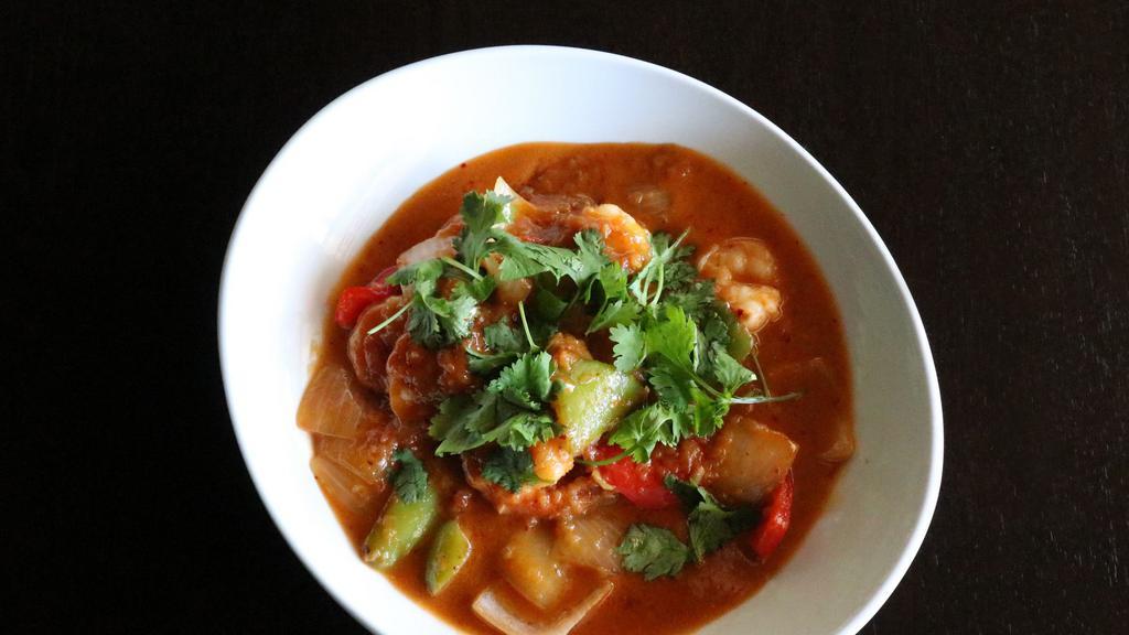 Shrimp Curry · Onion garlic tomato based curry, shrimp, yellow onions, bell
peppers, mild chili sauce, cilantro, coconut milk