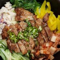 Grilled Chicken Kimchee Rice Bowl · Served with steamed rice kimchee seaweed salad yellow radish cucumber and coleslaw. steam ri...