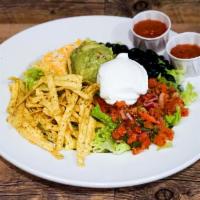 Taco Salad · Romaine lettuce, black beans, shredded cheddar and jack cheeses, pico de gallo, house-made t...