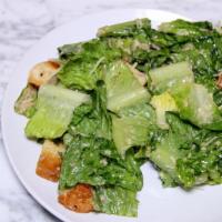Caesar Salad · Romaine lettuce tossed with Caesar dressing, shredded parmesan cheese and croutons.