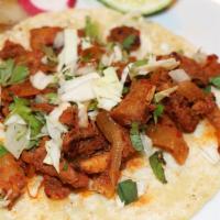 Al Pastor (Marinated Pork) · Delicious marinated pork taco!
Organic Corn Regular Size Tortilla.