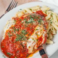 Chicken Parmigiana · Sautéed chicken breast in marinara sauce with fresh basil and mozzarella served with penne p...