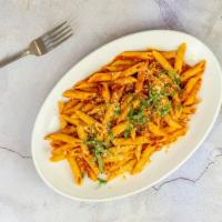 Penne Pomodoro · Vegan without the cheese on top. Penne pasta tossed with our classic homemade marinara sauce.