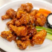 Hot Wings · Deep-fried wings tossed in Frank's RedHot Sauce®, served with a side of ranch dressing.