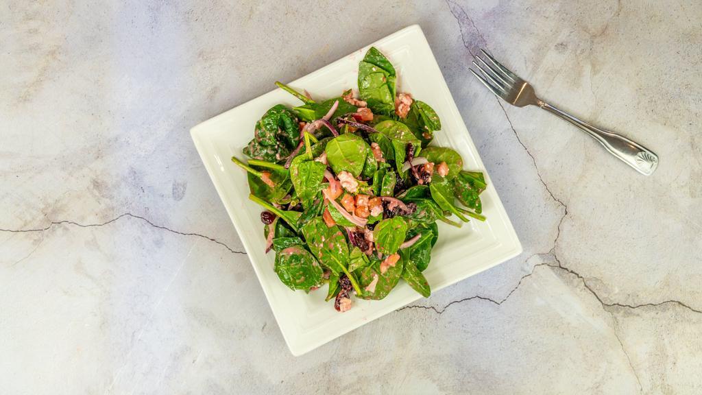 Spinach Salad · Healthy. Spinach, fresh diced tomatoes, red onions, dried cranberries, feta cheese, raspberry vinaigrette.