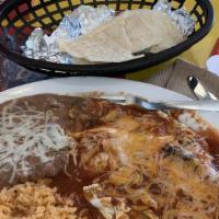 Huevos Rancheros · Eggs, served sunny-side-up over a crispy tortilla, and topped with melted cheddar cheese and...