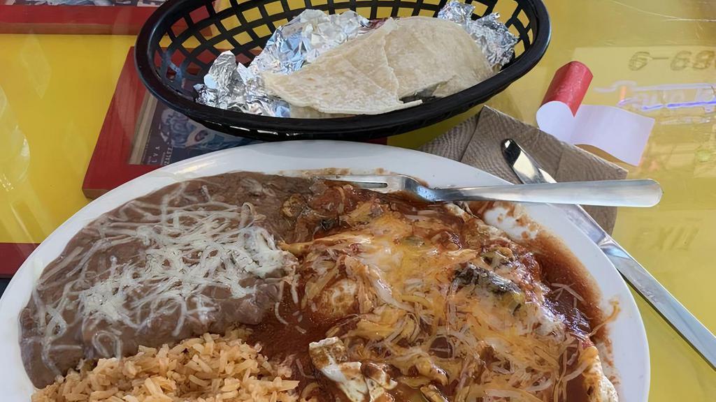 Huevos Rancheros · Eggs, served sunny-side-up over a crispy tortilla, and topped with melted cheddar cheese and homemade tomato sauce. Served with refried beans, rice and corn or flour tortillas.