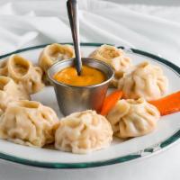 Vegetable Momo (8) · Steamed dumplings filled with minced cabbage, spinach, cashews nuts, paneer, onion, cilantro...