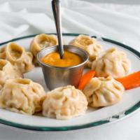 Chicken Momos (5 pcs) · A Nepalese-style steamed chicken dumpling, served with special spicy sauce.
