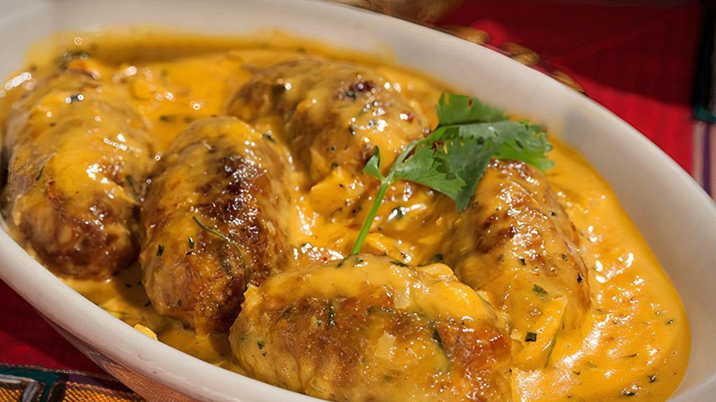 Malai Kofta · Mashed homemade cheese potatoes, nuts and spices combined together to make balls made of kofta, then cooked with a specially prepared sauce of nuts, cream, tomato and onion with herbs and spice.