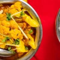 Aloo Gobi · Vegetarian and gluten-free. Cauliflower and potatoes cooked with onions, tomatoes and spices...