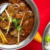 Goat Curry · Gluten free, Tender piece of bone in goat cooked with onions m tomatoes, garlic, ginger and ...