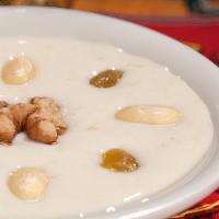 Rice Kheer · Delicious rice pudding, garnished with nuts and served chilled.