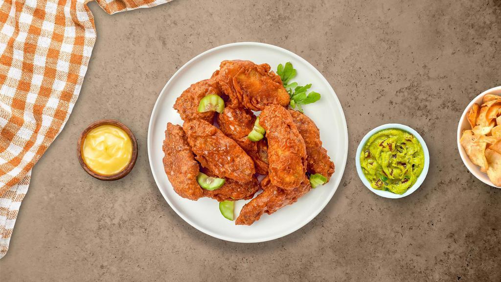 Insane Flamin' Hot Wings · (Eight pieces) Fresh chicken wings breaded, fried until golden brown, and tossed in flamin' hot sauce. Served with your choice of dipping sauce.