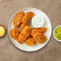Mango In The Night Habanero Wings · (Eight pieces) Fresh chicken wings breaded, fried until golden brown, and tossed in mango ha...