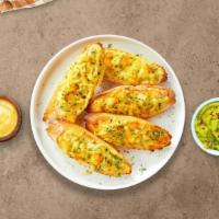 Classic Garlic Bread · Housemade bread toasted and garnished with our signature creamy garlic sauce, mozzarella che...
