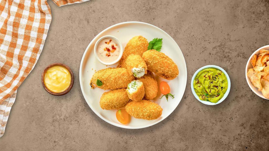 Popper Stopper · Fresh Jalapeño coated in potatoes, filled with cheddar cheese, and fried until golden brown. Served with your choice of dipping sauce.