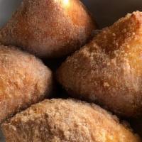 Dough-Nuts · Dough-Nuts made with our pizza dough, covered in cinnamon and sugar