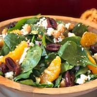 Greek Baby Spinach Orange Salad · baby spinach, orange slices, chickpeas, feta, Kalamata olives, toasted sesame seeds
