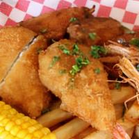 Fried Combo · Cajun chicken wings, codfish fillet, Fried Shrimp, French fries, 2 piece corn