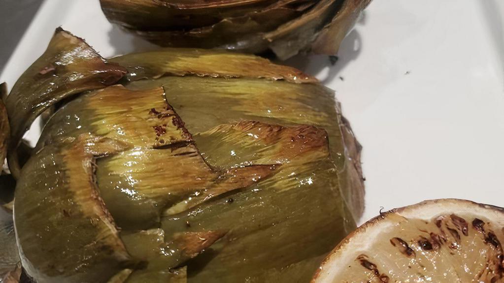 Roasted Artichoke · One whole artichoke trimmed and steamed until tender. Halved, the sautéed in EVOO served with a Tarragon Dip.