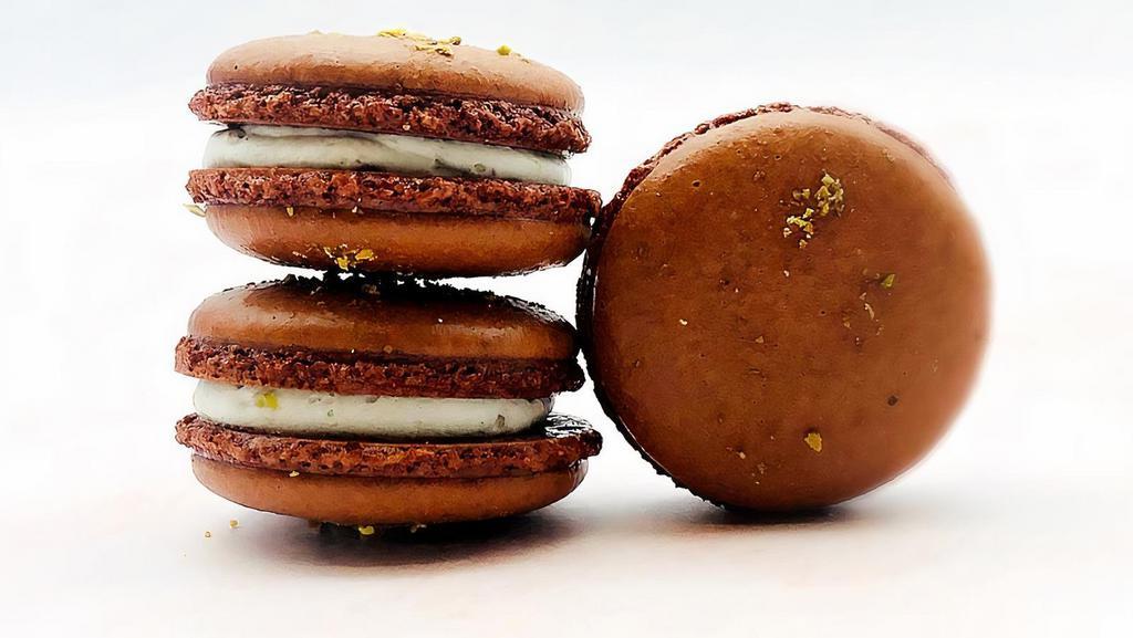 Vegan Hazelnut Pistachio Macarons · Dairy free, gluten free. Introducing plant based macarons, dairy free and gluten free. Hazelnut pistachio macarons are available in 4 or 12 pack. Ingredients: almond flour, sugar, aquafaba, vegetable oil, hazelnut flavor, crushed pistachio, vegetable oil.