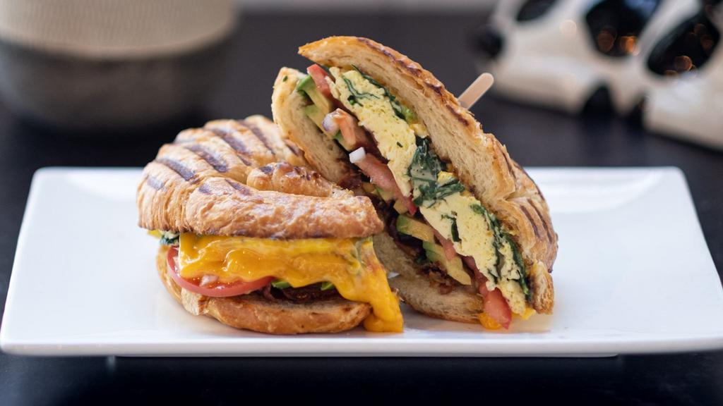 Breakfast Sandwich · Two scrambled eggs and cheese on your choice of toast, bagel, or croissant. Add bacon, ham, or sausage, spinach, tomato, avocado for an additional charge.