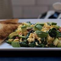 Breakfast Scramble · Two eggs, avocado, tomatoes, spinach, and cheese served with toast.