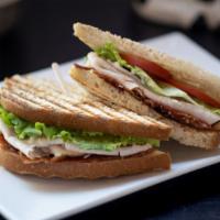 Club Sandwich · Turkey, bacon, lettuce, tomato, and Mayo served on sliced sourdough.
