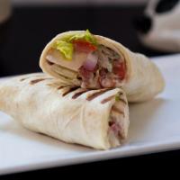 Chicken Gyro Wrap · Grilled chicken, red onion, lettuce, tomato, and cucumber yogurt, served in a wrap.