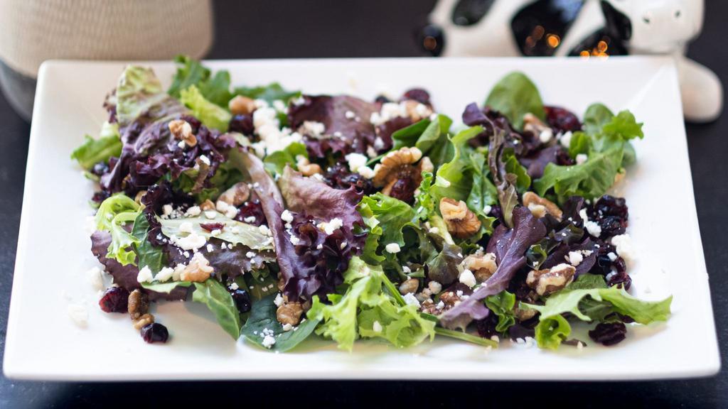 Garden Salad · Spring mix, feta cheese, toasted walnuts, dried cranberries tossed with homemade balsamic vinaigrette.