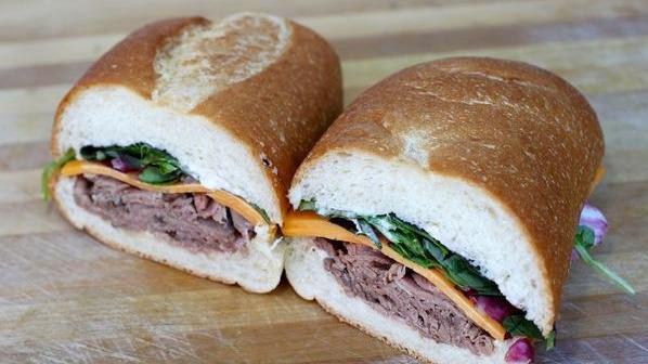 McCovey · Roast beef, roasted balsamic onion, cheddar cheese, mixed greens, and horseradish mayo.